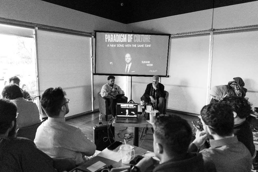 Black and white wide view of a Nuun speaker event