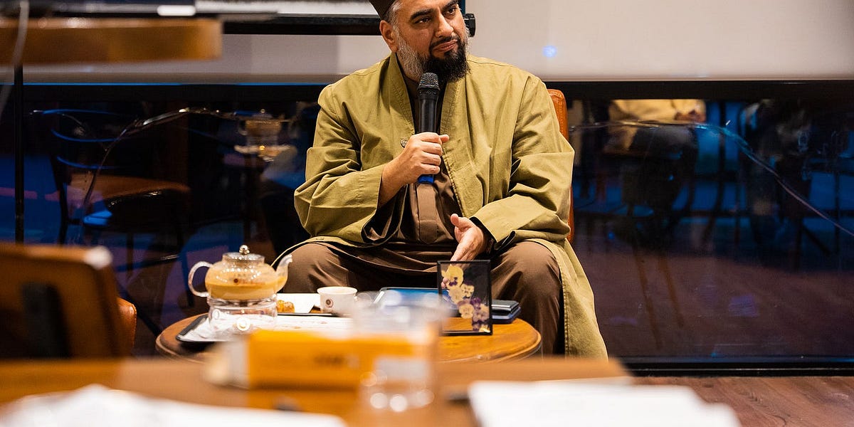 Nuun speaker holding a microphone at a community gathering